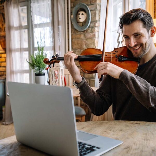 man-student-learns-to-play-the-violin-online-using-2021-09-03-17-18-19-utc
